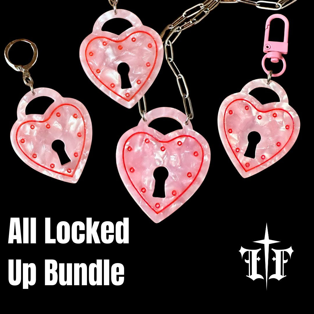 Heart-shaped lock keychains with pink glitter on a black background, featuring the brand 'LF'.
