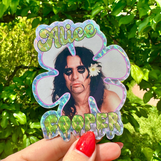 Sticker of Alice Cooper held in front of green foliage