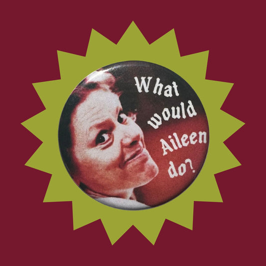 pin button of Aileen Wournos's face with a red to dark background with white text that says "What would Aileen do?"