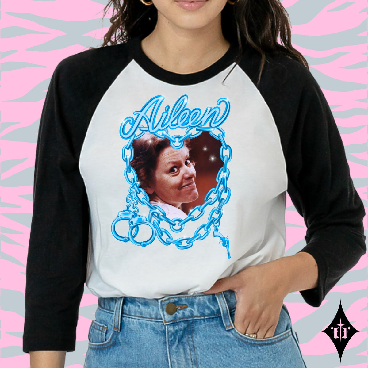 Aileen Wuornos photo and blue chain heart graphic on a black and white raglan shirt