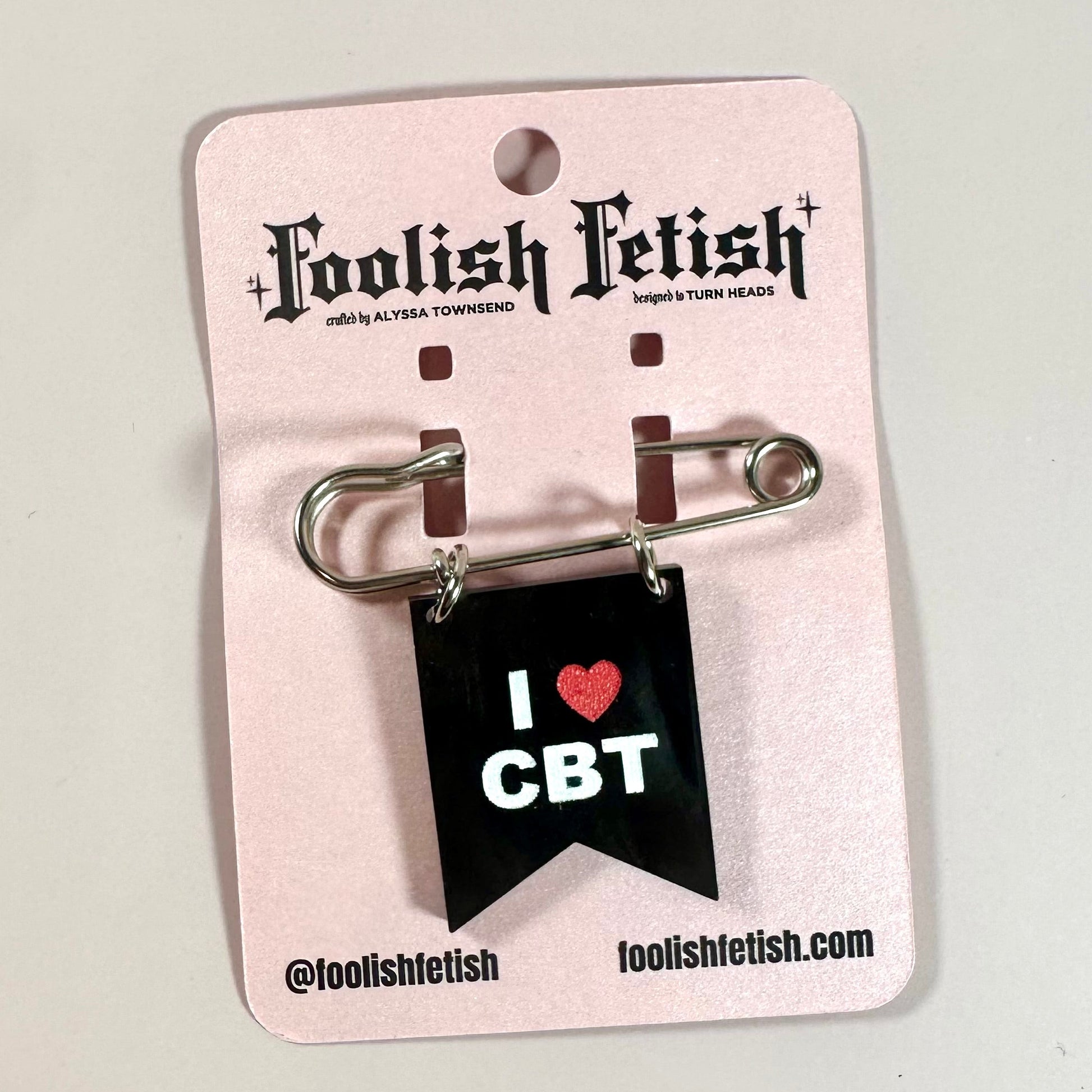 Pin with 'I ❤️ CBT' design on a pink card with 'Foolish Fetish' branding.