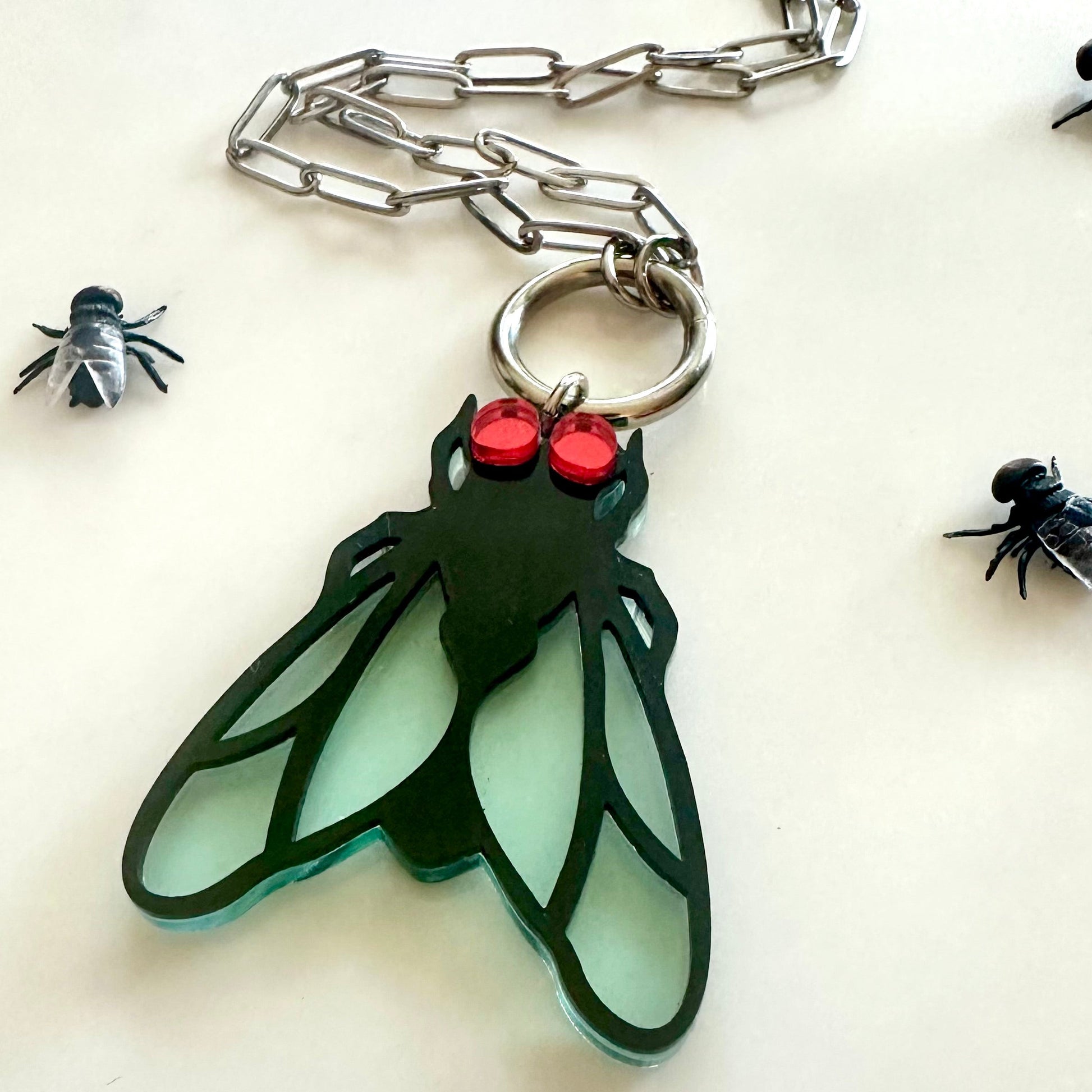 Keychain with insect design on a white background