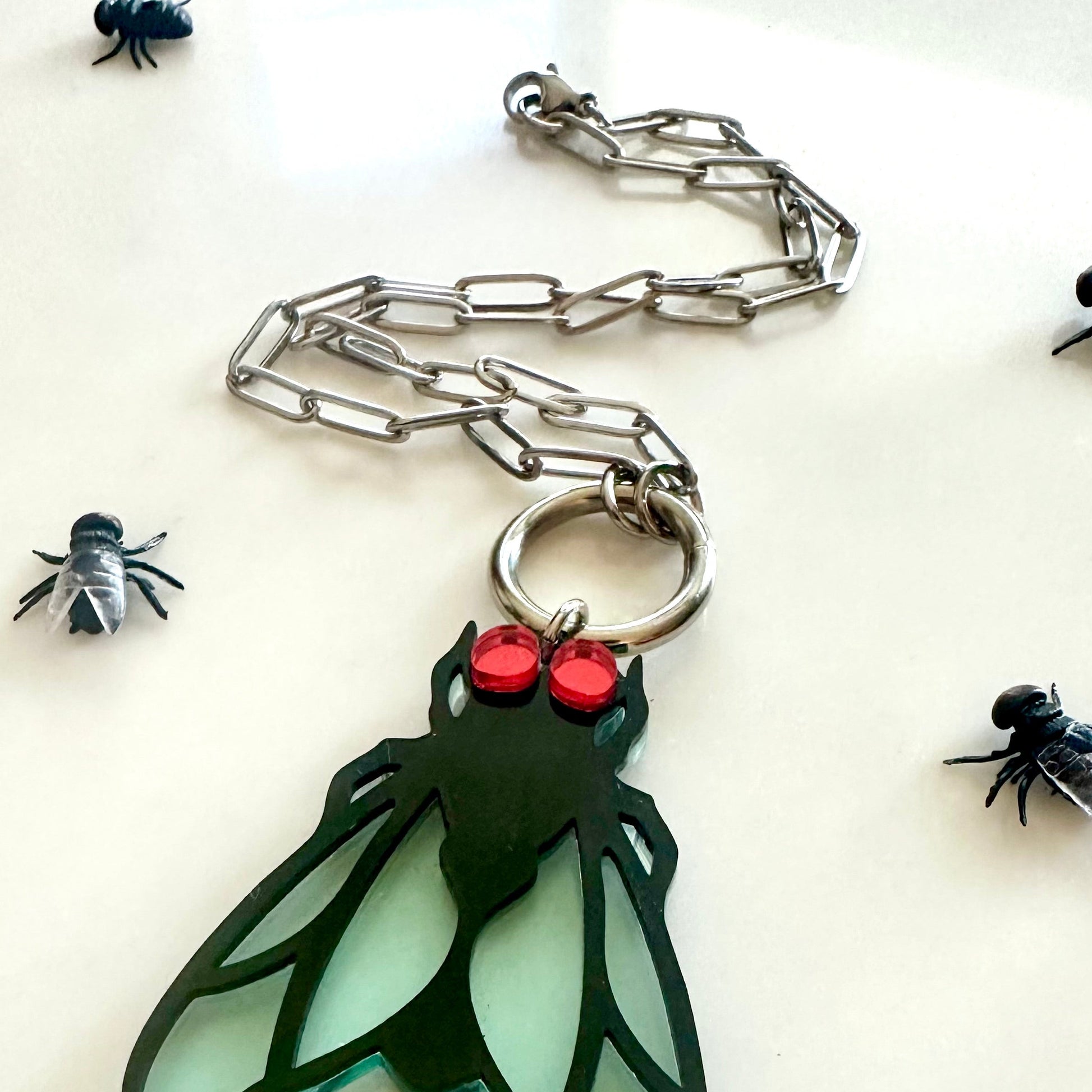 Keychain with insect design on a white background