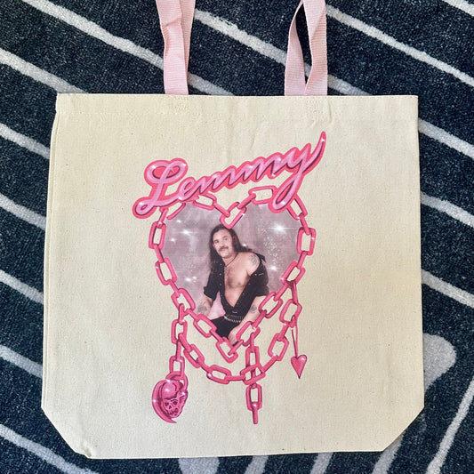 Tote bag with a graphic design featuring a person and the word 'Lemmy' on a striped background