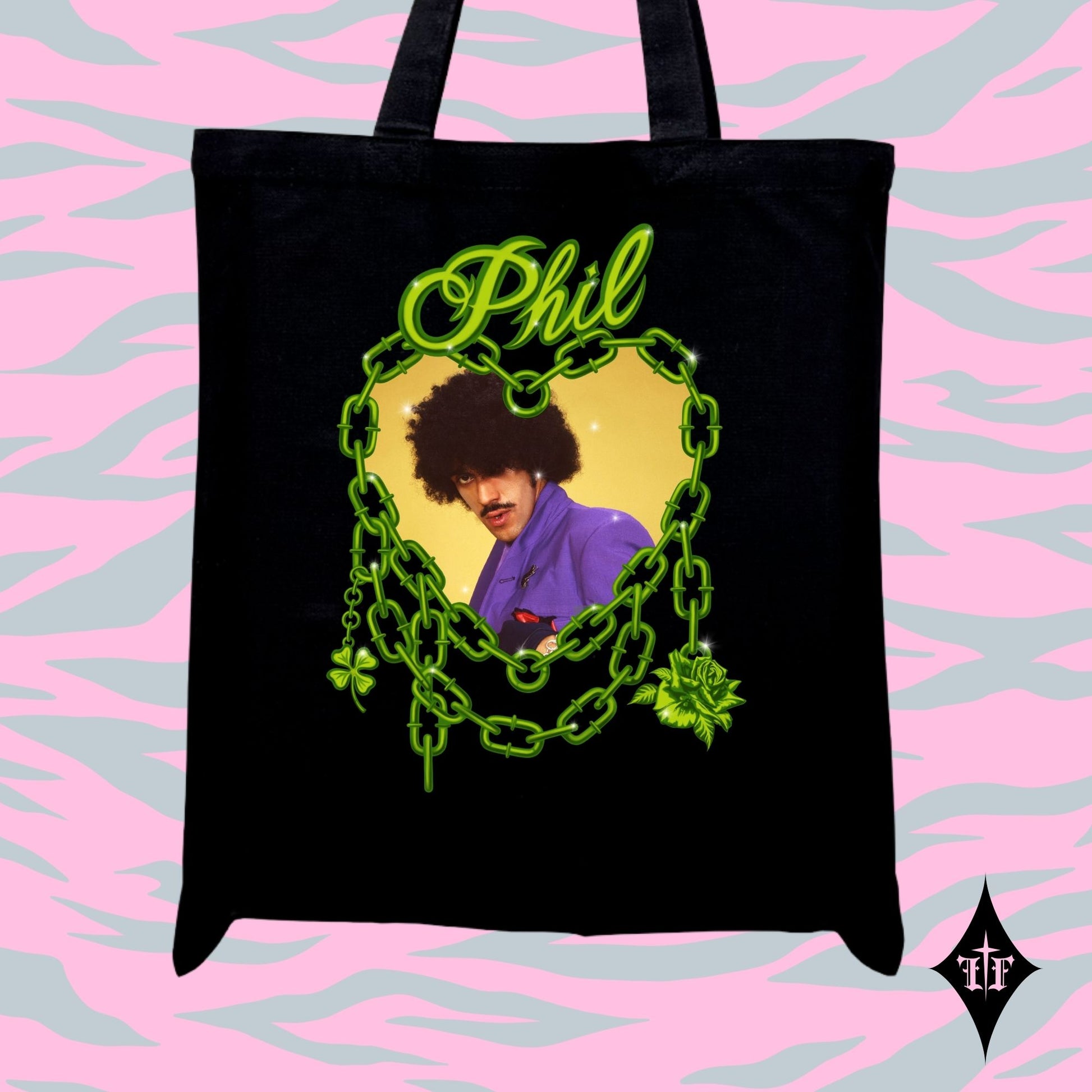 Black tote bag with a colorful graphic of a person with an afro and text 'Phil' on a pink and gray patterned background.