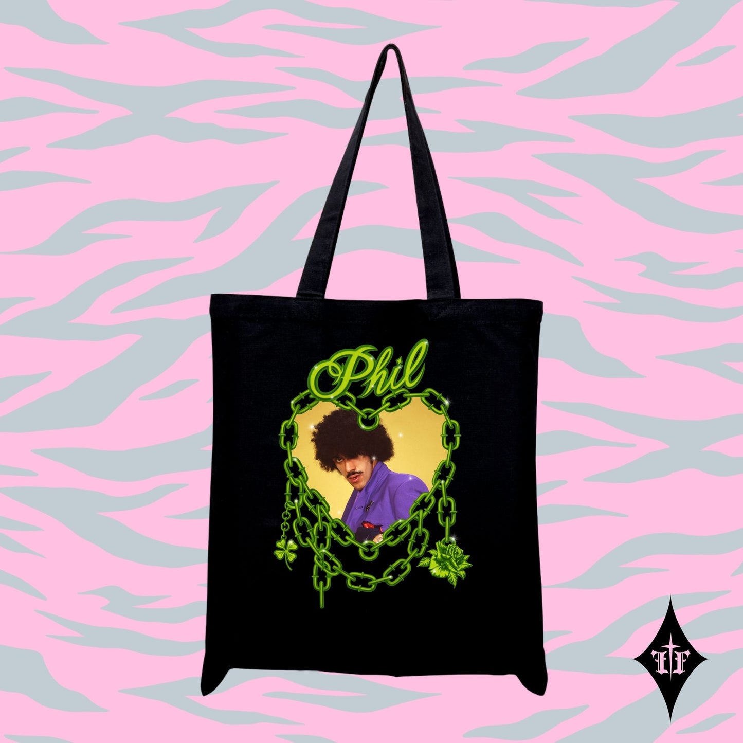 Black tote bag with a graphic design of a person in a purple shirt and text 'Phil' on a pink and blue patterned background.