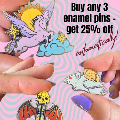Enamel pins held by hands with promotional text on a colorful background