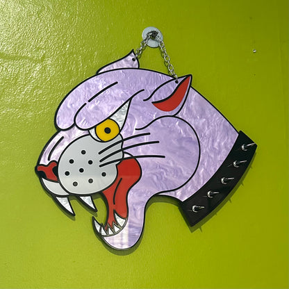 Cartoonish cat head design on a green background